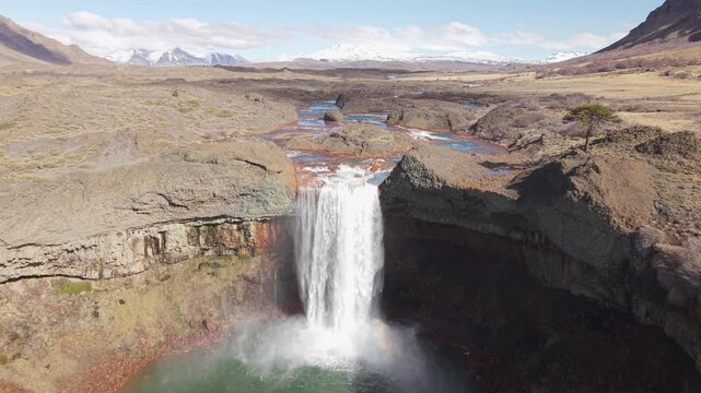 Salto del Agrio Waterfall Red Water and Basalt Columns Aerial 4K. Filmed with a DJI Air 3S drone in 4K UHD at 29.97 fps. Perfect for nature documentaries, geology, tourism in Argentina.