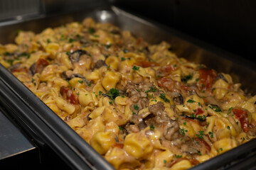 Serving pan with mushroom pasta. Creamy Mushroom Pasta.