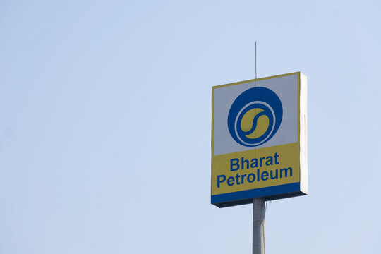 Bharat Petroleum logo displayed on a tall signboard under blue sky, symbolizing India's oil and petrol industry amid global stock volatility, sanctions, Russia, profit, dividend, loss, results
