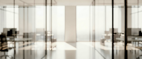 Bright blurred modern office interior with daylight and neutral tones. Contemporary workspace with structured lighting and clean design, suitable for business backgrounds.