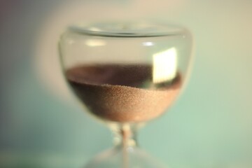 Hourglass as symbol of passing time concept photo	
