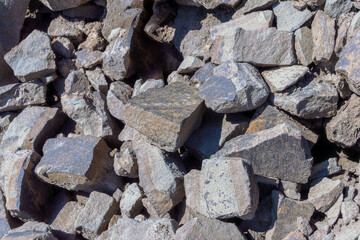 Angular stones interlock under pressure creating stable layer supporting weight and resisting environmental wear over years selective focus