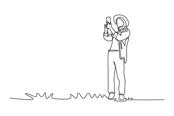 Woman tourist capturing photos of an ancient fortress for a travel blog. Travel experience concept. Single line draw design. Vector graphic illustration