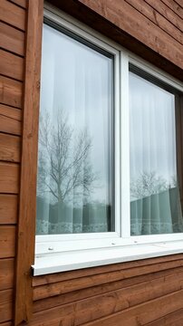 Close Up of Brown Wood Siding Exterior Window Frame