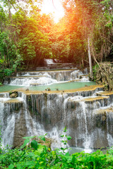 Huay Mae Khamin Waterfall in Sri Nakarin Dam Nation Park, beautiful group of limestone falls comprising of 7 tiers altogether . Rocks in the waterfall and clear water at Kanchanaburi ,Thailand .