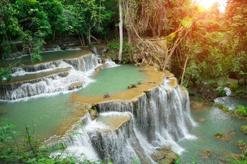 Huay Mae Khamin Waterfall in Sri Nakarin Dam Nation Park, beautiful group of limestone falls comprising of 7 tiers altogether . Rocks in the waterfall and clear water at Kanchanaburi ,Thailand .