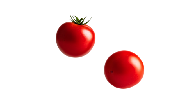 Fresh red tomatoes float gracefully in midair, isolated on white