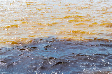 Meeting of waters Rio Negro and Amazon River Amazonas Brazil.