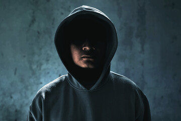 Closeup of hacker in hoodie