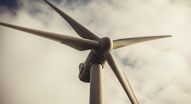 Wind turbine generating clean energy. Renewable power generation concept for environmental sustainability and green technology. - Powered by Adobe