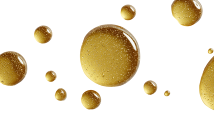 Golden liquid drops against a stark black backdrop, macro view