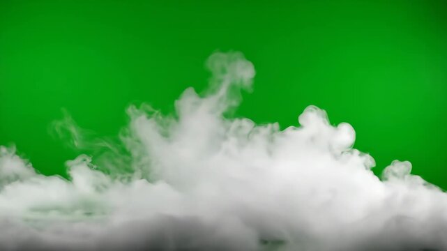 Simulated Fog Effect on Green Screen - White fog or vapor rises against a solid green screen background. The fog obscures the lower portion of the frame, creating a useful visual effect.