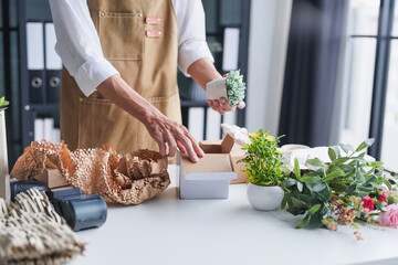 Small Business Owner Carefully Packing Eco-Friendly Products into Recyclable Cardboard Box for Online Order Sustainable E-Commerce and Zero-Waste Shipping Concept