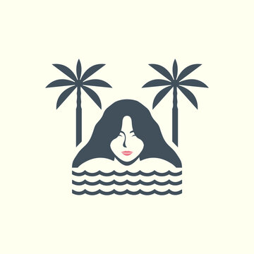 Serene woman relaxing in the ocean between two tropical palm trees.