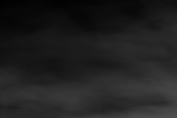 Dark Ethereal Smoke or Fog Background Texture with Grayscale Vapors and Mysterious Atmospheric Haze for Abstract Design Overlay and Copy Space