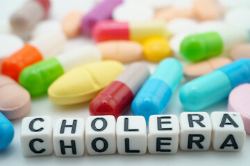 Cholera Disease word with pills and capsules medical drug.