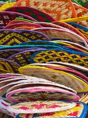 Colorful hand fans on display, showcasing traditional craftsmanship and design
