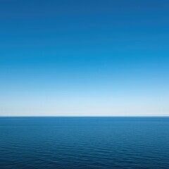 Obraz premium Extremely wide-angle view of the infinite ocean horizon under a deep blue sky, showing enormous space for copy and design elements ,backdrop ,horizon ,water