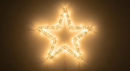Brightly illuminated star-shaped light fixture with warm yellow LED bulbs, creating a festive and magical glow for Christmas or a special event