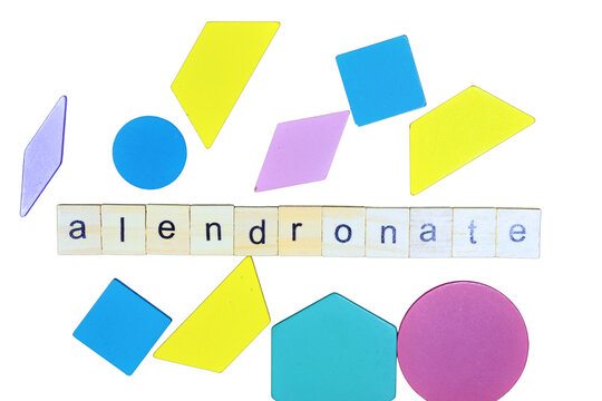 "On a white backdrop, the writing notion for alendronate is developed. a medication that slows bone loss in order to treat and prevent osteoporosis.
 