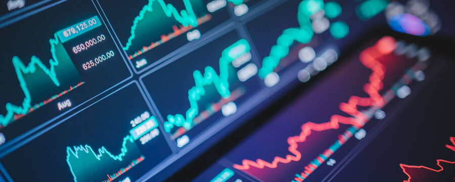 Stock market data charts on a computer screen showing financial trends