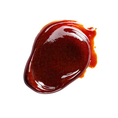 Glossy dollop of dark brown, viscous sauce against black backdrop