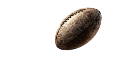 Worn, weathered football against a black background, softly lit