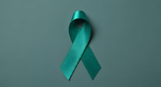 Teal ribbon symbolizing ovarian and cervical cancer awareness on a teal background 21971331 1