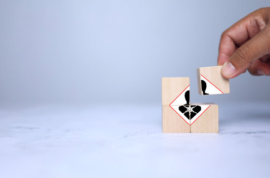 inhalation toxicity warning concept with hand arrange wooden cube represent to indicates that a substance is harmful if inhaled, and can cause respiratory damage or even systemic disease