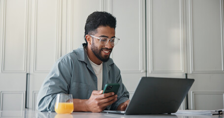 Freelancer, smartphone and man with laptop, home or research for ebook marketing on social media app. Online, brand awareness and self publisher with tech for novel promotion, web and person in house