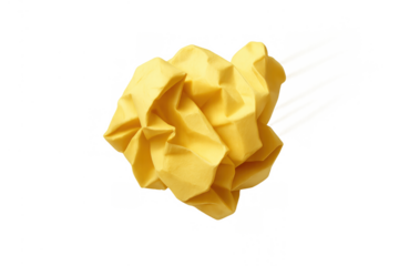 Crumpled yellow paper representing discarded ideas, waste, failure, mistakes, and problem-solving process