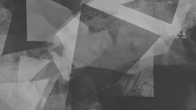 An abstract monochrome art piece of overlapping triangles and textured backgrounds