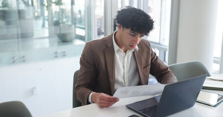 Laptop, documents and review with business man in office for insurance broker, risk assessment and...