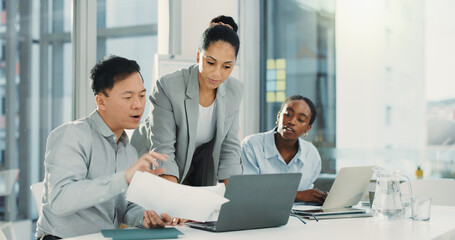 Business people, laptop and meeting with paperwork for proposal, finance or accounting report at office. Group of employees, documents and discussion for company revenue, profit or financial growth