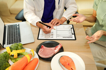 The healthcare professional providing nutritional guidance to a patient.