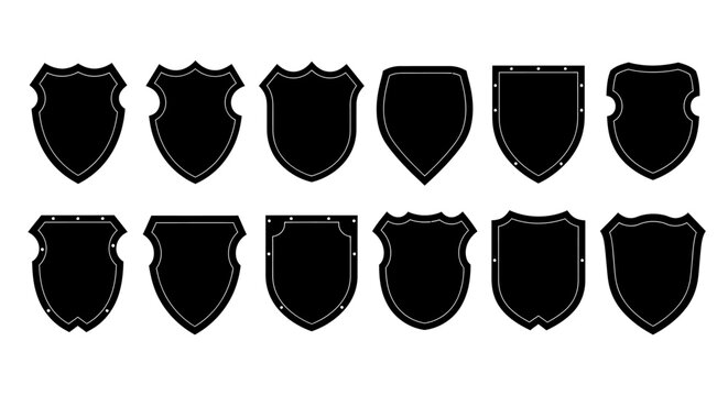 Collection of diverse black shield silhouettes with distressed textures and varied shapes for heraldry and design