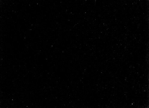 Dark black grunge texture background with subtle dust specks, faint scratches and aged film grain for vintage overlays and design project use now


