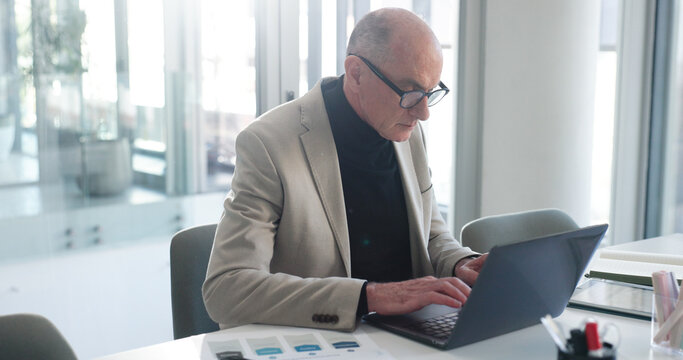 Laptop, review and typing with business man in office for insurance broker, risk assessment and report. Planning, premium policy and underwriter with mature person for claims coverage payout