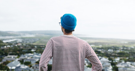 Perspective, outdoor or man view sunrise for inspiration, morning reflection or holiday thinking with space. Town observation, solitude or person with insight from vacation, vision or ideas from back