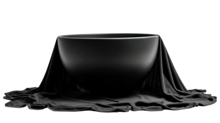 Round bowl draped in soft fabric against a dark, stark backdrop