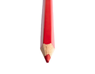 Close-up of a sharpened, vibrant red wooden pencil