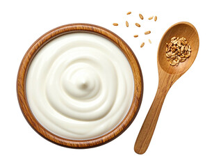 Creamy yogurt in wooden bowl, seeds scattered with wooden spoon
