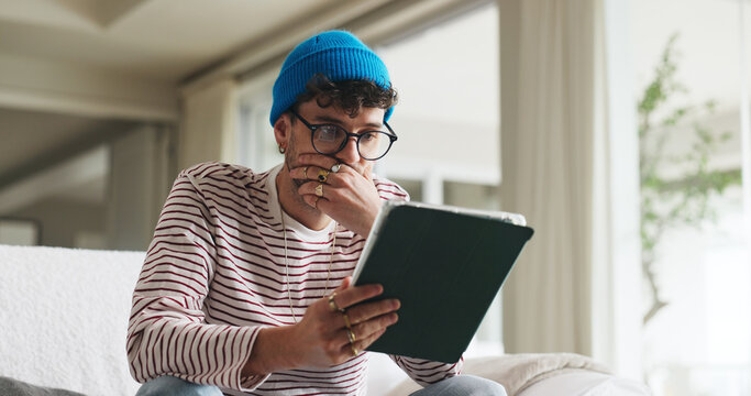 Shock, tablet and man on sofa in home with social media, gossip or scroll for internet news. Notification, tech and person with communication for connectivity, online or mobile app in living room