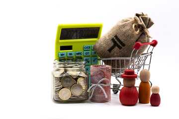 5,000 Kazakhstani tenge banknotes and a glass jar with 100 Kazakhstani tenge coins