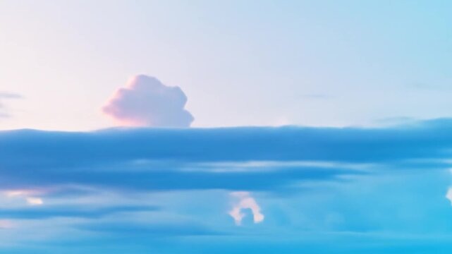 Soft pastel clouds drift across a sky of pink, purple, and blue