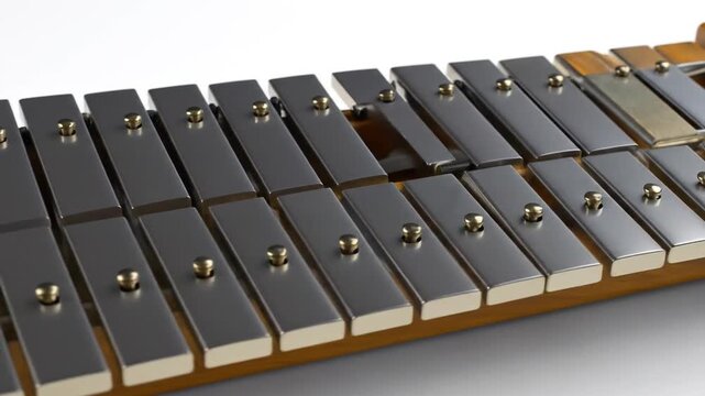 A close-up view of a metallic percussion instrument with gleaming bars and brass accents
