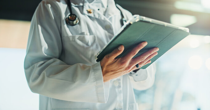 Hands, doctor and person with tablet for medical info, patient history or telehealth in clinic. Tech, healthcare worker and report in hospital for insurance records, wellness email or research