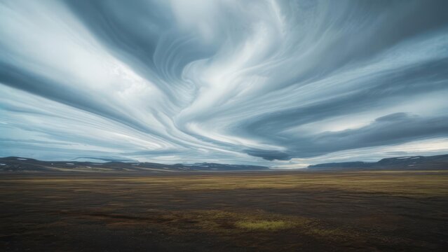 Dramatic clouds over a vast landscape