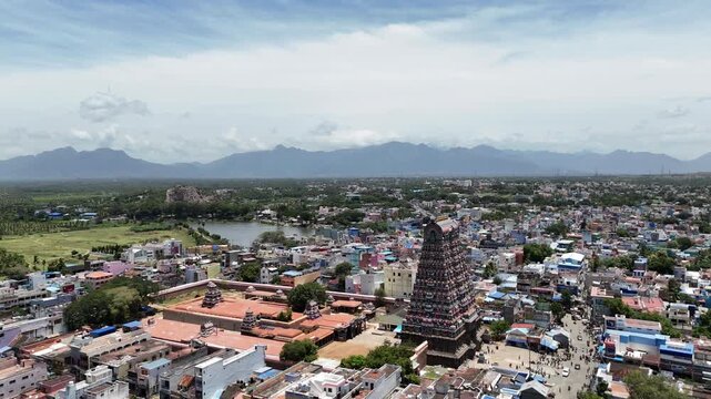 Aerial view of Tenkasi, Tamil Nadu, with the grand Kasi Viswanathar Temple at its center. The temple's impressive gopuram rises above the town's tightly packed Dravidian buildings.