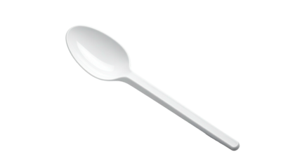 White plastic spoon isolated on dark
